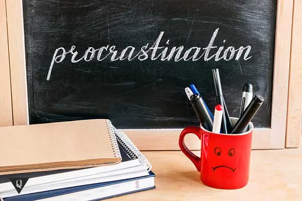 What is procrastination and what is a procrastinator?