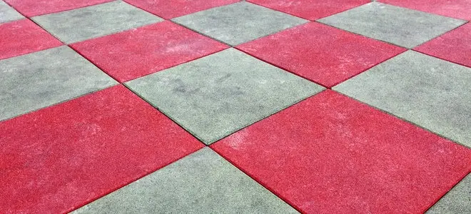 Laying rubber tiles on the ground