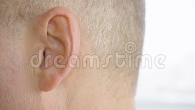 Shooting in the ear of an adult