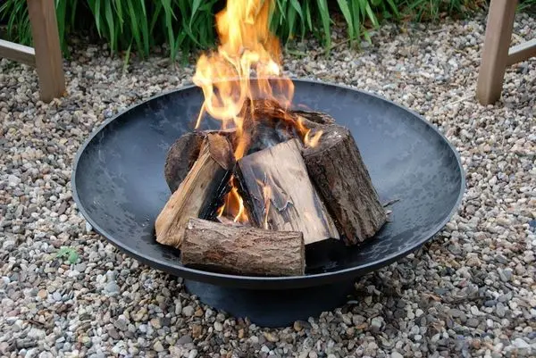 A hearth for a fire in a country house made of stone, metal, brick: a step-by-step construction scheme + photos of finished garden fireplaces