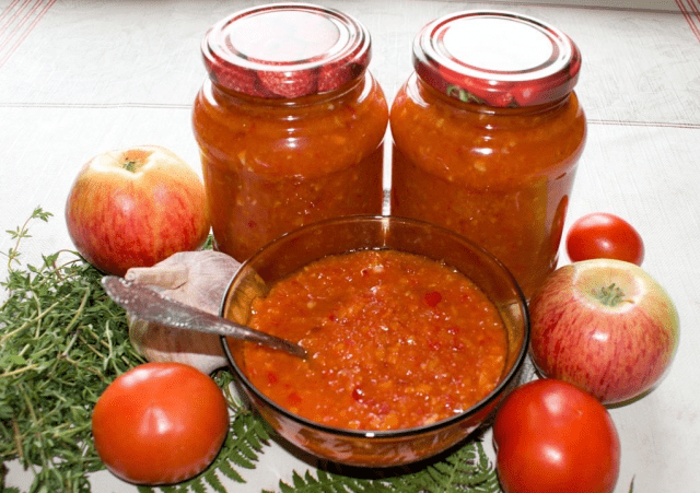 Adjika with tomatoes, peppers and apples 