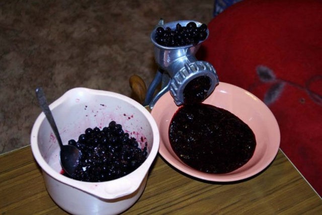 Blackcurrant jam in a meat grinder