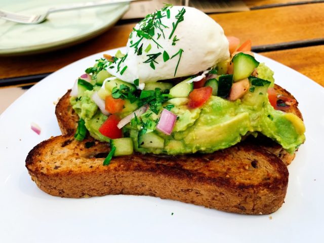 Bruschetta with avocado and shrimps, fish, crab, egg