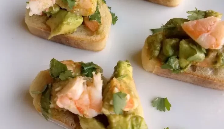 Bruschetta with avocado and shrimps, fish, crab, egg