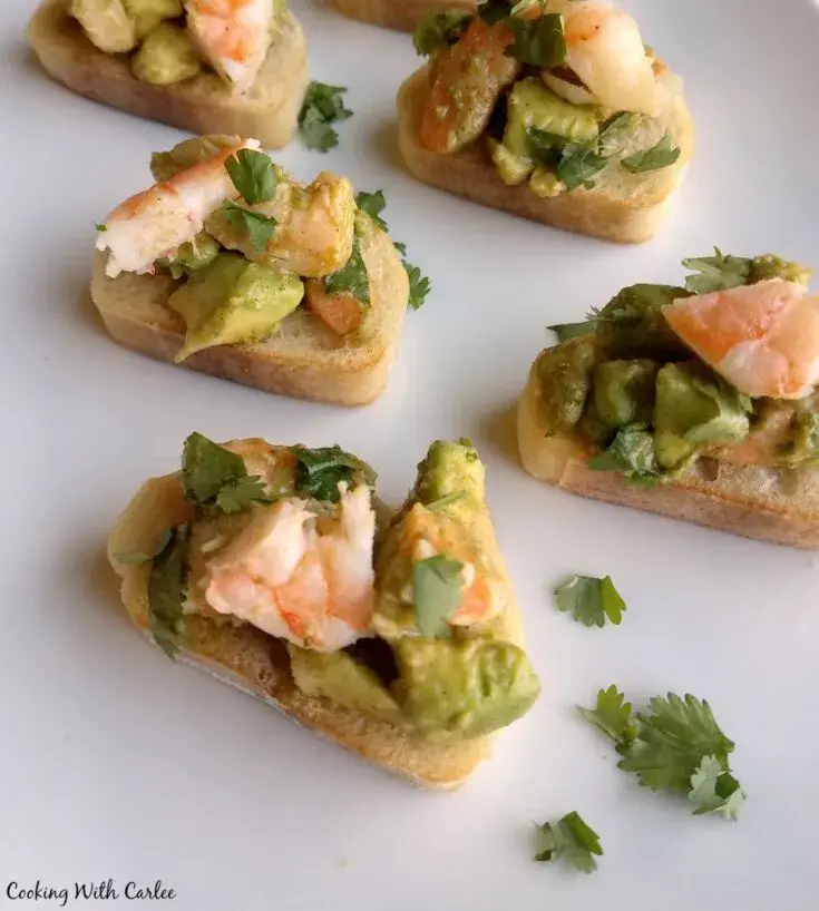 Bruschetta with avocado and shrimps, fish, crab, egg