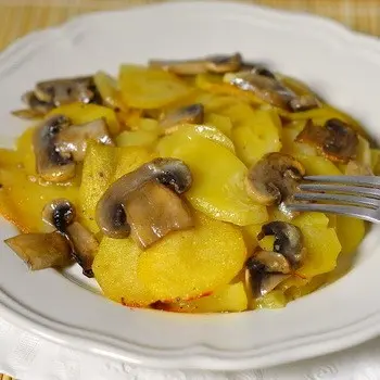 Cabbage with mushrooms and potatoes in a slow cooker and oven