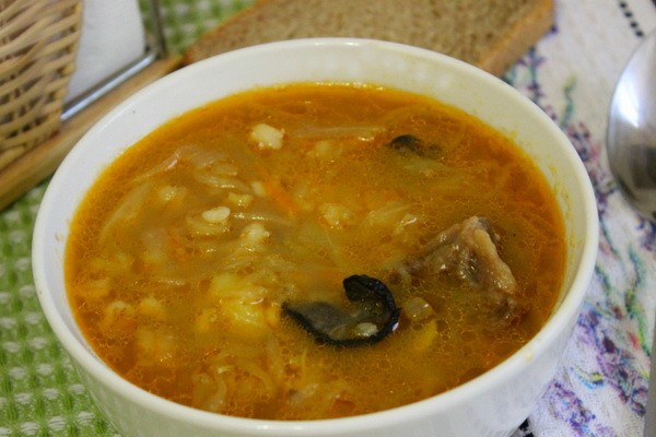 Cabbage with mushrooms and potatoes in a slow cooker and oven