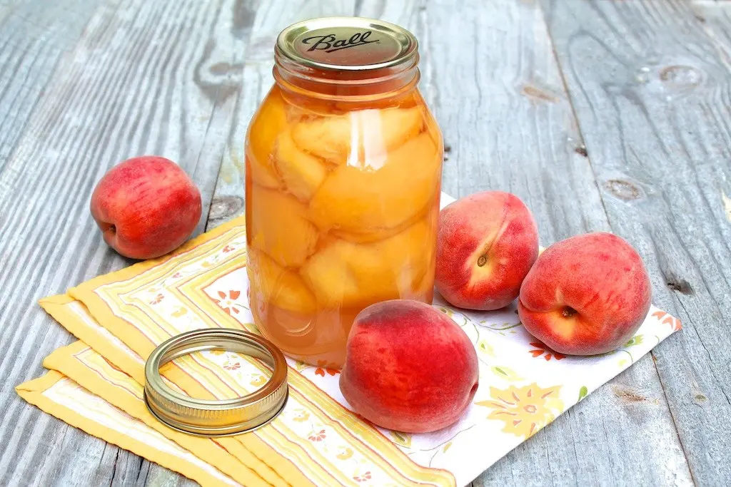 Canned peaches in syrup for the winter