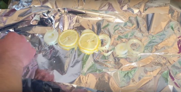 Carp in the oven in foil: whole, slices, steaks, fillets