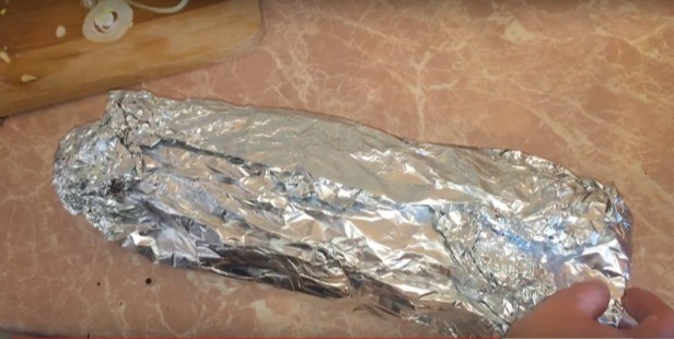 Carp in the oven in foil: whole, slices, steaks, fillets