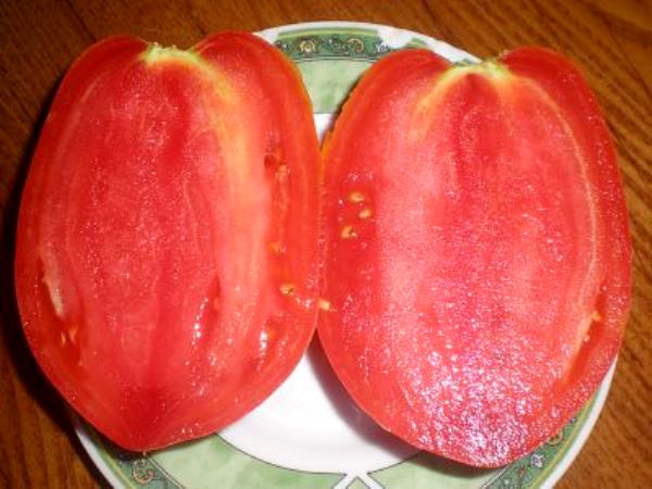 Characteristics of the pink flamingo tomato variety with a photo