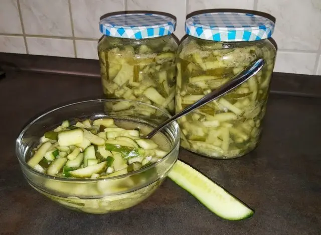 Cucumber salad for the winter with butter: salting recipes with garlic, onions, and tomatoes