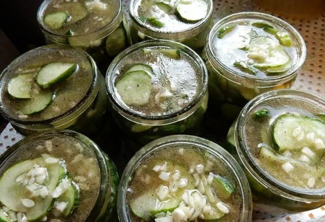 Cucumber salad for the winter with butter: salting recipes with garlic, onions, and tomatoes