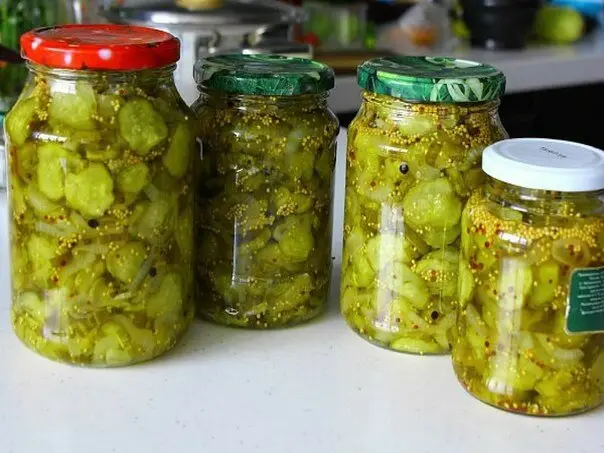 Cucumber salad with turmeric for the winter: canning recipes