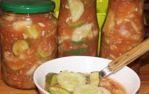 Cucumber salads in tomato juice: awesome recipes for the winter