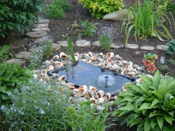 Do-it-yourself pond from an old bath: materials, step-by-step workflow, decor ideas + photos of finished ponds