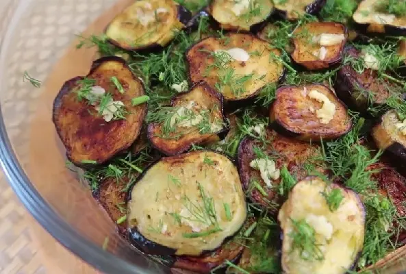 Eggplant for the winter with garlic and dill: recipes for snacks and salads