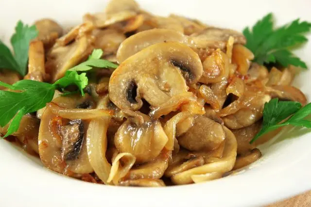 Fried champignons with onions in a pan, in a slow cooker: how delicious to fry with carrots, whole