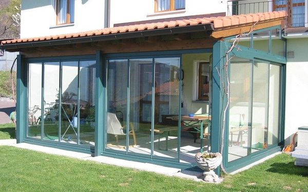 Glazing of the veranda: plastic, aluminum, wooden frames, frameless, panoramic windows, warm, cold double-glazed windows