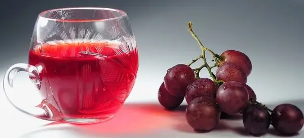 Grape juice for the winter at home through a juicer, juicer or manual extraction