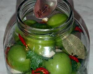 Green tomatoes, like barrels in jars