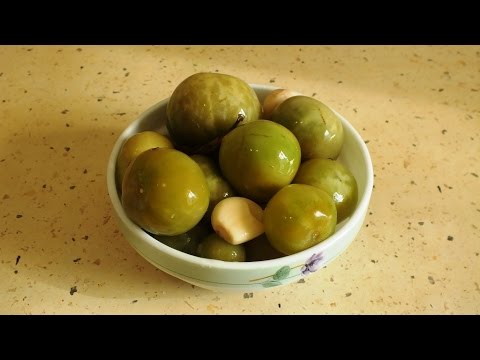 Green tomatoes, like barrels in jars