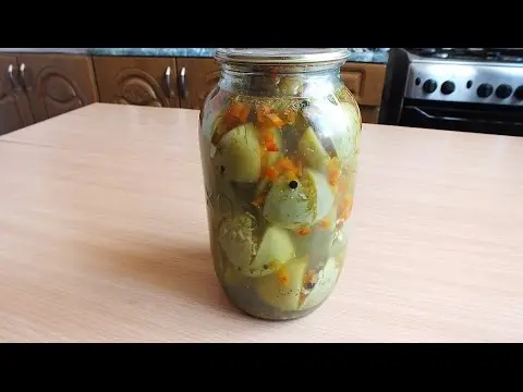 Harvesting green tomatoes for the winter in jars 