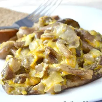 Honey mushrooms stewed in a slow cooker, oven and on a short