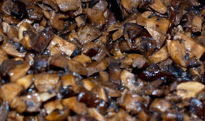 Honey mushrooms stewed in a slow cooker, oven and on a short