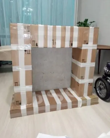 How to make a fireplace out of boxes for the New Year: photo, video