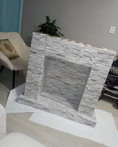 How to make a fireplace out of boxes for the New Year: photo, video