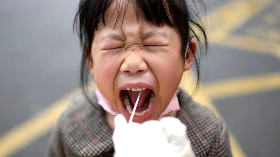 Is the child whining while eating? This could be a symptom of COVID-19