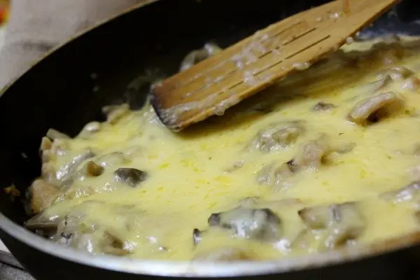 Julienne with mushrooms and cheese in the oven and in a frying pan