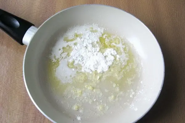 Julienne with mushrooms and cheese in the oven and in a frying pan