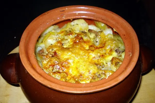 Julienne with mushrooms and cheese in the oven and in a frying pan