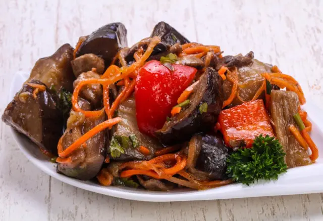 Korean-style eggplant for the winter: without sterilization, with carrots, cabbage, tomatoes