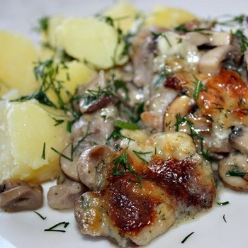 Meat with mushrooms baked in the oven or slow cooker