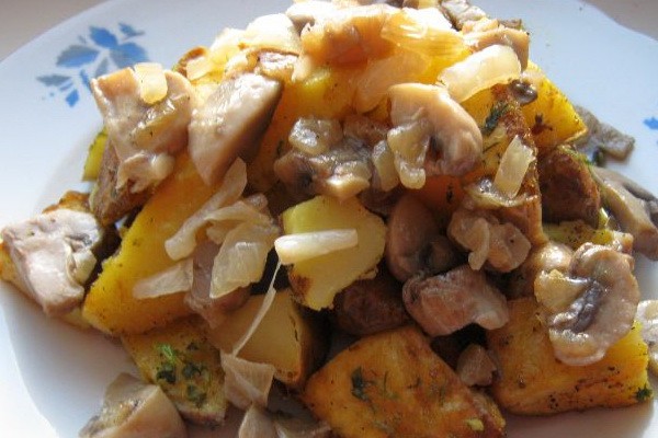 Meat with mushrooms baked in the oven or slow cooker