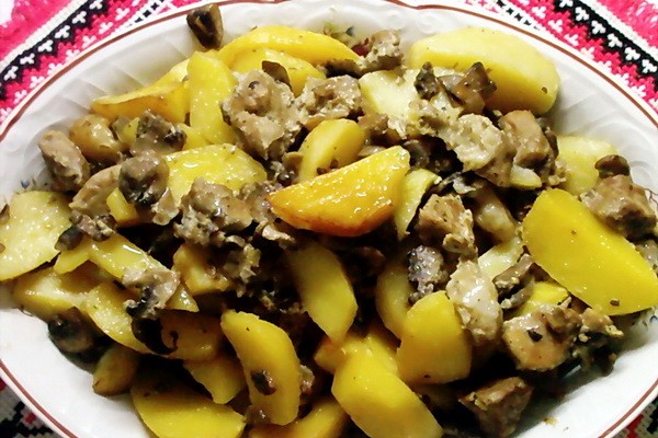 Meat with mushrooms baked in the oven or slow cooker