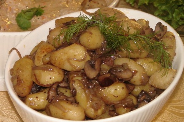 Meat with mushrooms baked in the oven or slow cooker