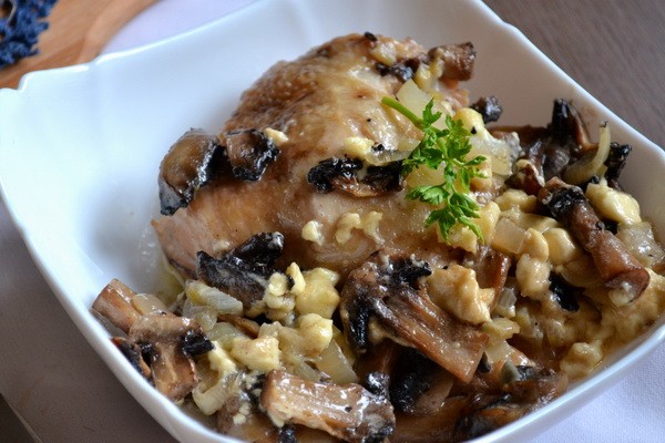 Meat with mushrooms baked in the oven or slow cooker