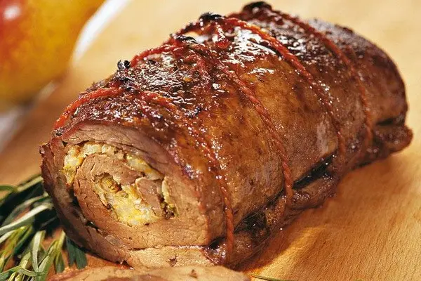 Meat with mushrooms baked in the oven or slow cooker