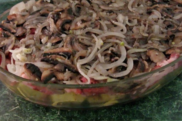 Meat with mushrooms baked in the oven or slow cooker