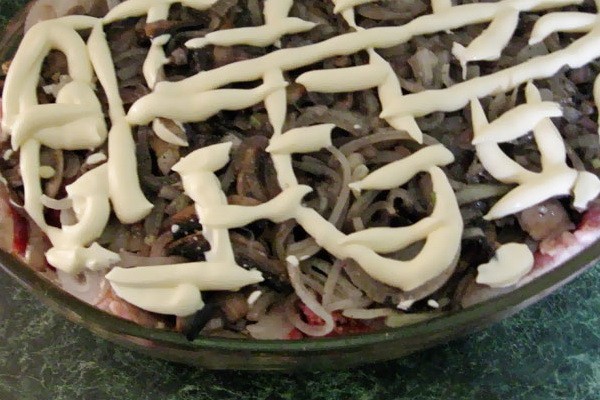 Meat with mushrooms baked in the oven or slow cooker