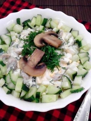 Mushroom salads with champignons and cucumbers