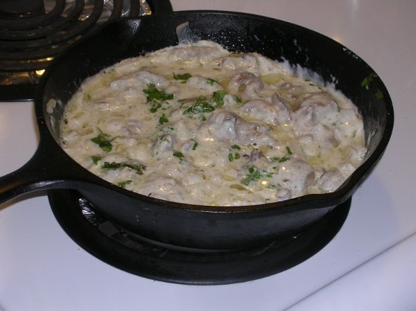 Oyster mushrooms in sour cream in a pan and in the oven: with onions, potatoes, pork