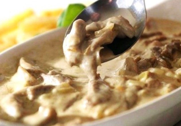 Oyster mushrooms in sour cream in a pan and in the oven: with onions, potatoes, pork