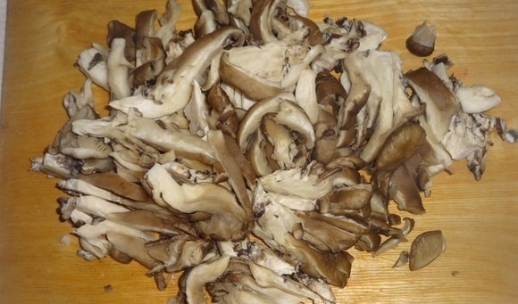 Oyster mushrooms in sour cream in a pan and in the oven: with onions, potatoes, pork