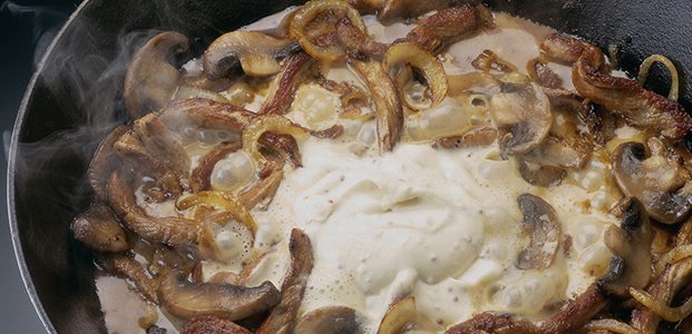 Oyster mushrooms in sour cream in a pan and in the oven: with onions, potatoes, pork