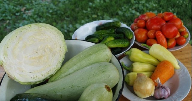 Pickled assorted tomatoes with cucumbers, zucchini, cabbage